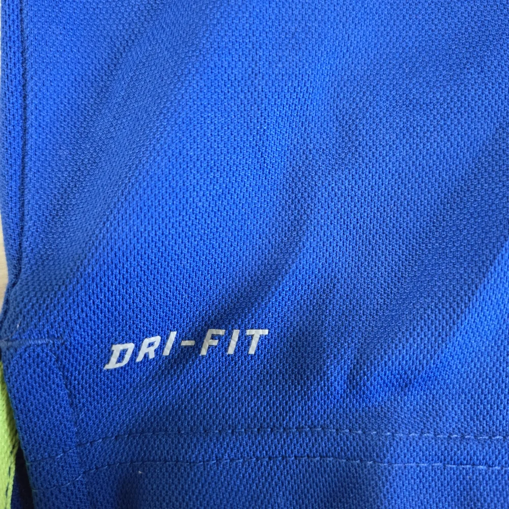 Nike DriFit Kids Medium Polo Shirt in Vibrant Blue W Volt Yellow Logo